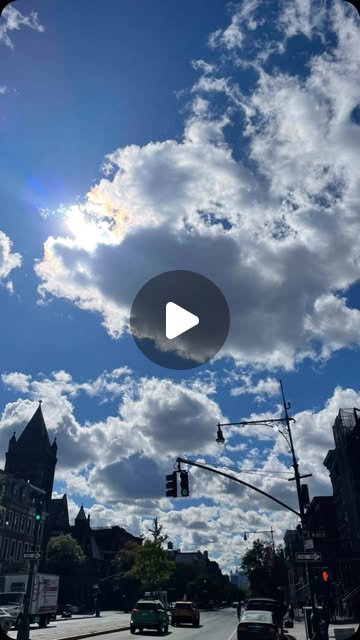 Harlem avenue under a wide sky of clouds